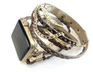 The Boho watch band features three straps on each side of your watch that wrap around the wrist creating the perfect boho style. The three straps include one faux braided leather strap, one gold chain, and one snake print faux leather strap. This boho band has a one size fits all connector fitting watch sizes 38/40/42/44. This band fits wrist sizes 6.25"-7.5" and closes with three different snaps for your custom size.