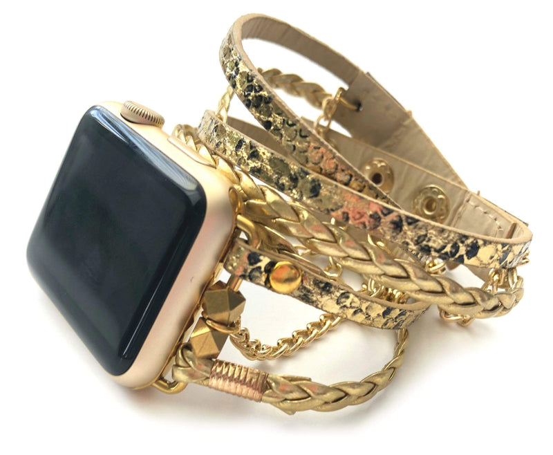 The Boho watch band features three straps on each side of your watch that wrap around the wrist creating the perfect boho style. The three straps include one faux braided leather strap, one gold chain, and one snake print faux leather strap. This boho band has a one size fits all connector fitting watch sizes 38/40/42/44. This band fits wrist sizes 6.25"-7.5" and closes with three different snaps for your custom size