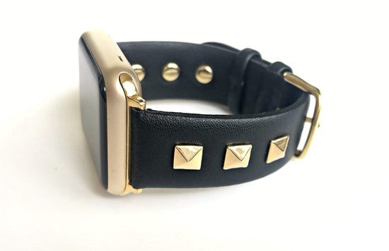 Beautiful BLACK top grain genuine LEATHER, STUDDED Apple Watch Band. This watch band features a stainless steel buckle and is adorned with three metal studs on each side. Stud color choices include Silver, Gold, and Rose Gold.  This watch band fits all series of Apple Watches. Comes in sizes 38/40 and 42/44