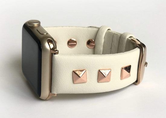 Beautiful CREAM top grain genuine LEATHER, STUDDED Apple Watch Band. This watch band features a stainless steel buckle and is adorned with three metal studs on each side. Stud color choices include Silver, Gold, and Rose Gold.  This watch band fits all series of Apple Watches. Comes in sizes 38/40 and 42/44