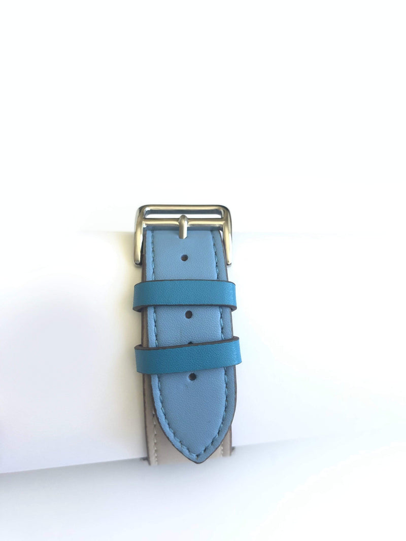 Men's and Women's blue and cream genuine leather strap. One strap blue and one strap cream. Leather straps contains blue stitching around entire outer edge.  This Apple Watch Band fits all apple series watches sized 42/44mm.  Fits wrist sizes 6.5"-8"