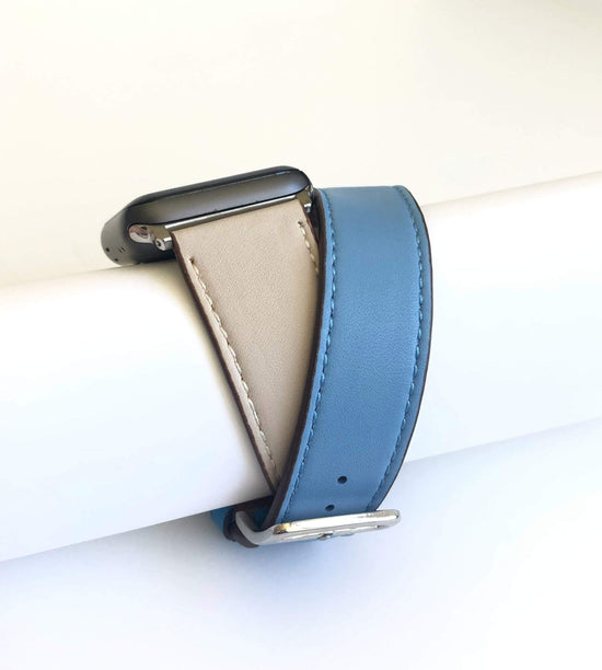 Men's and Women's BLUE  AND CREAM genuine leather strap. Leather strap contains white stitching around entire outer edge. Strap is designed to wrap around the wrist twice creating a solid cuff look. This Apple Watch Band fits all apple series watches sized 42/44mm. Fits wrist sizes 6.5"-8"