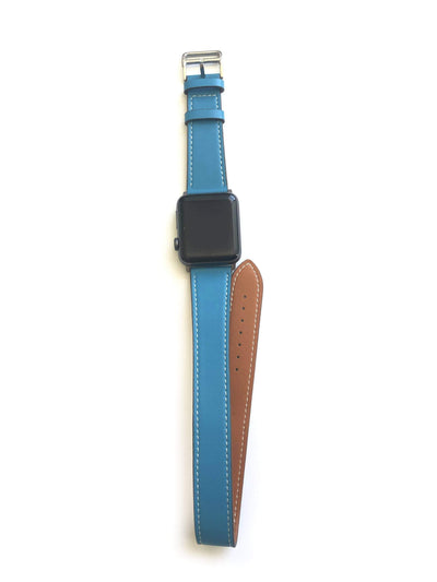 Men's and Women's BLUE  AND CREAM genuine leather strap. Leather strap contains white stitching around entire outer edge. Strap is designed to wrap around the wrist twice creating a solid cuff look. This Apple Watch Band fits all apple series watches sized 42/44mm. Fits wrist sizes 6.5"-8"