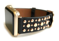 Beautiful BLACK top grain genuine LEATHER, STUDDED Apple Watch Band. This watch band features a stainless steel buckle and is adorned with several flat circular studs. Stud color choices include Silver, Gold, and Rose Gold.  This watch band fits all series of Apple Watches. Comes in sizes 38/40 and 42/44