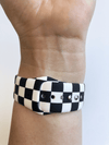 This sporty black and white checkerboard silicone apple watch band is the must have band of the season! Looks great on men, women and children. Sizes: Small/Medium will fit wrist size 5”-7.5” Medium/Large will fit wrist sizes 6”-8.25”