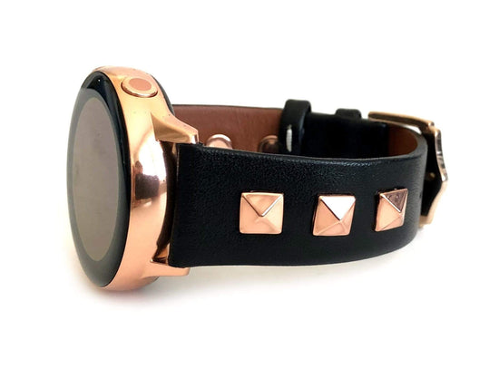 Beautiful black top grain genuine leather studded watch band. This watch band features a stainless steel buckle and is adorned with three metal studs on each side. Stud color choices include Silver, Gold, and Rose Gold. Studs are square shaped and slightly raised in the center giving them a pyramid shape. This watch band features a quick release spring bar and is a perfect fit for the Samsung watch. 