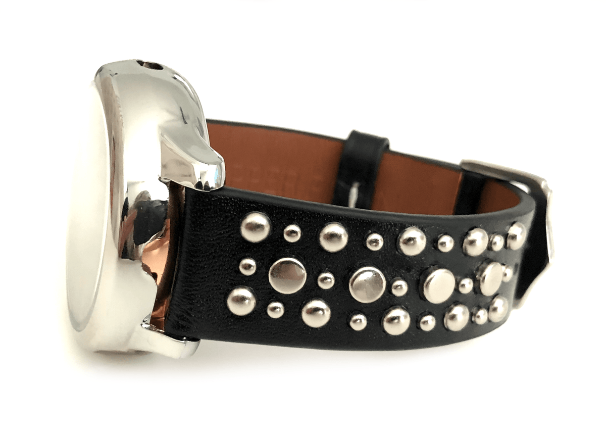 Beautiful black top grain genuine leather studded watch band. This watch band features a stainless steel buckle and is adorned with several flat circular metal studs on each side. Stud color choices include Silver, Gold, and Rose Gold. This watch band features a quick release spring bar and is a perfect fit for the Samsung watch. 