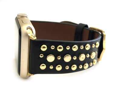 Beautiful BLACK top grain genuine LEATHER, STUDDED Apple Watch Band. This watch band features a stainless steel buckle and is adorned with several flat circular studs. Stud color choices include Silver, Gold, and Rose Gold.  This watch band fits all series of Apple Watches. Comes in sizes 38/40 and 42/44