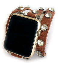 Super soft camel brown colored leather wrap Apple Watch Band with silver studs and crystal studs. 3 snaps to help you find your perfect size Sizing: fits a wrist size of 5.75”- 7”. Available for watch sizes 38/40/42/44mm fitting all series apple watches.