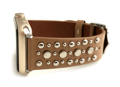 Beautiful TAN top grain genuine LEATHER, STUDDED Apple Watch Band. This watch band features a stainless steel buckle and is adorned with several flat circular studs. Stud color choices include Silver, Gold, and Rose Gold.  This watch band fits all series of Apple Watches. Comes in sizes 38/40 and 42/44