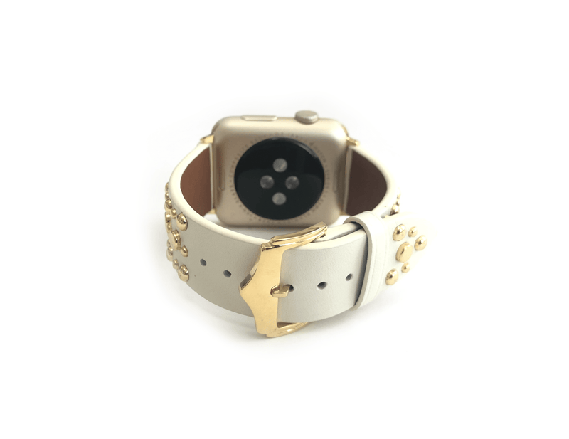 Beautiful WHITE top grain genuine LEATHER, STUDDED Apple Watch Band. This watch band features a stainless steel buckle and is adorned with several flat circular studs. Stud color choices include Silver, Gold, and Rose Gold.  This watch band fits all series of Apple Watches. Comes in sizes 38/40 and 42/44