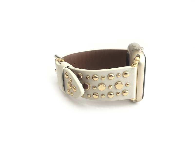 Beautiful WHITE top grain genuine LEATHER, STUDDED Apple Watch Band. This watch band features a stainless steel buckle and is adorned with several flat circular studs. Stud color choices include Silver, Gold, and Rose Gold.  This watch band fits all series of Apple Watches. Comes in sizes 38/40 and 42/44