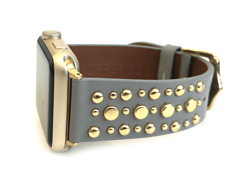 Beautiful GREY top grain genuine LEATHER, STUDDED Apple Watch Band. This watch band features a stainless steel buckle and is adorned with several flat circular studs. Stud color choices include Silver, Gold, and Rose Gold.  This watch band fits all series of Apple Watches. Comes in sizes 38/40 and 42/44