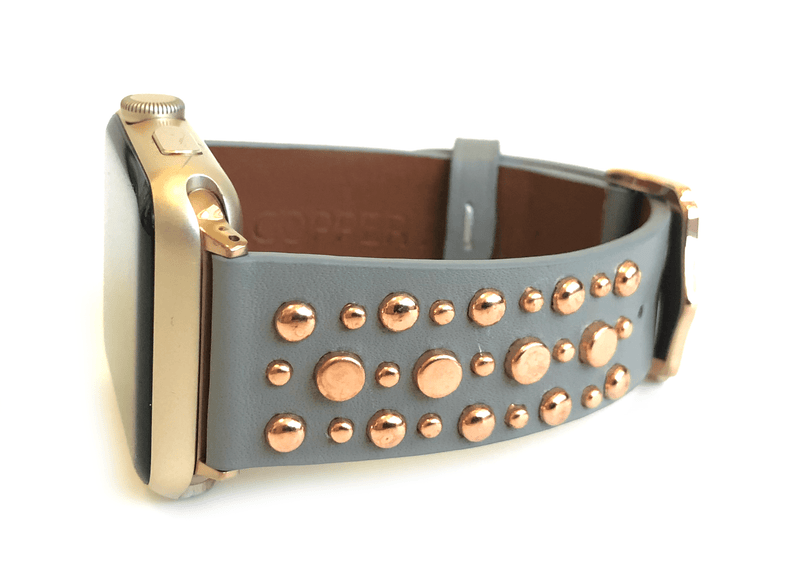 Beautiful GREY top grain genuine LEATHER, STUDDED Apple Watch Band. This watch band features a stainless steel buckle and is adorned with several flat circular studs. Stud color choices include Silver, Gold, and Rose Gold.  This watch band fits all series of Apple Watches. Comes in sizes 38/40 and 42/44