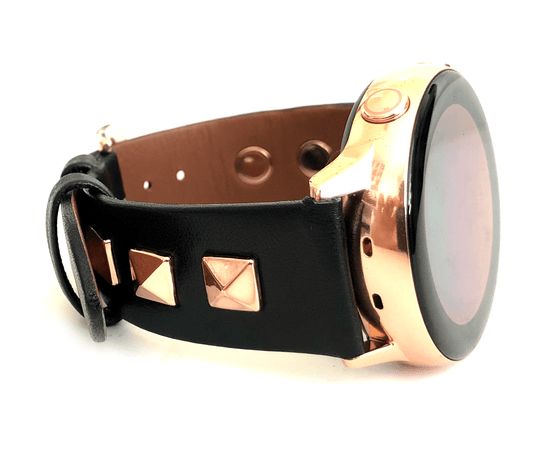 Beautiful black top grain genuine leather studded watch band. This watch band features a stainless steel buckle and is adorned with three metal studs on each side. Stud color choices include Silver, Gold, and Rose Gold. Studs are square shaped and slightly raised in the center giving them a pyramid shape. This watch band features a quick release spring bar and is a perfect fit for the Samsung watch. 