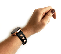 Beautiful black top grain genuine leather studded watch band. This watch band features a stainless steel buckle and is adorned with three metal studs on each side. Stud color choices include Silver, Gold, and Rose Gold. Studs are square shaped and slightly raised in the center giving them a pyramid shape. This watch band features a quick release spring bar and is a perfect fit for the Samsung Watch.