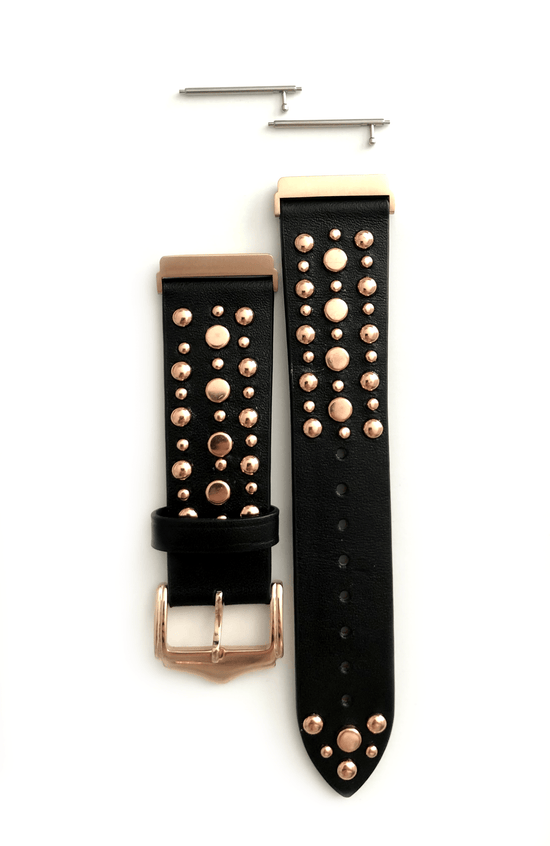 Beautiful black top grain genuine leather studded watch band. This watch band features a stainless steel buckle and is adorned with several flat circular metal studs on each side. Stud color choices include Silver, Gold, and Rose Gold. This watch band features a quick release spring bar and is a perfect fit for the Fitbit Versa watch.