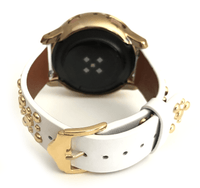 Beautiful WHITE top grain genuine LEATHER STUDDED watch band. This watch band features a stainless steel buckle and is adorned with several flat circular metal studs on each side. Stud color choices include Silver, Gold, and Rose Gold. This watch band features a quick release spring bar and is a perfect fit for the Samsung watch. 