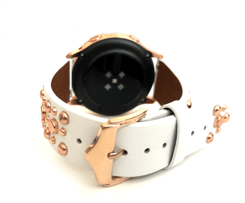 Beautiful WHITE top grain genuine LEATHER STUDDED watch band. This watch band features a stainless steel buckle and is adorned with several flat circular metal studs on each side. Stud color choices include Silver, Gold, and Rose Gold. This watch band features a quick release spring bar and is a perfect fit for the Samsung watch. 