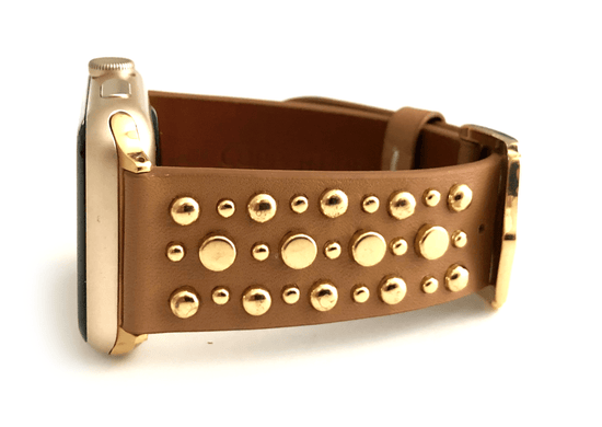 Beautiful TAN top grain genuine LEATHER, STUDDED Apple Watch Band. This watch band features a stainless steel buckle and is adorned with several flat circular studs. Stud color choices include Silver, Gold, and Rose Gold.  This watch band fits all series of Apple Watches. Comes in sizes 38/40 and 42/44