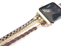 The Boho watch band features three straps on each side of your watch that wrap around the wrist creating the perfect boho style. The three straps include one faux braided leather strap, one gold chain, and one snake print faux leather strap. This boho band has a one size fits all connector fitting watch sizes 38/40/42/44. This band fits wrist sizes 6.25"-7.5" and closes with three different snaps for your custom size