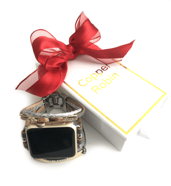 Luxury apple watch band with faux grey and silver leather straps that give a bracelet style look to your apple watch. Accented with gold plates, crystals, and silver metallic finishes. Adjustable fold over clasps for easy sizing.