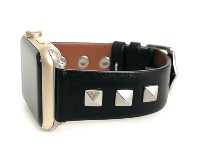 Beautiful black top grain genuine leather studded watch band. This watch band features a stainless steel buckle and is adorned with three metal studs on each side. Stud color choices include Silver, Gold, and Rose Gold. Studs are square shaped and slightly raised in the center giving them a pyramid shape.