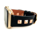 Beautiful BLACK top grain genuine LEATHER, STUDDED Apple Watch Band. This watch band features a stainless steel buckle and is adorned with three metal studs on each side. Stud color choices include Silver, Gold, and Rose Gold. Studs are square shaped and slightly raised in the center giving them a pyramid shape. This watch band fits all series of Apple Watches. Comes in sizes 38/40 and 42/44