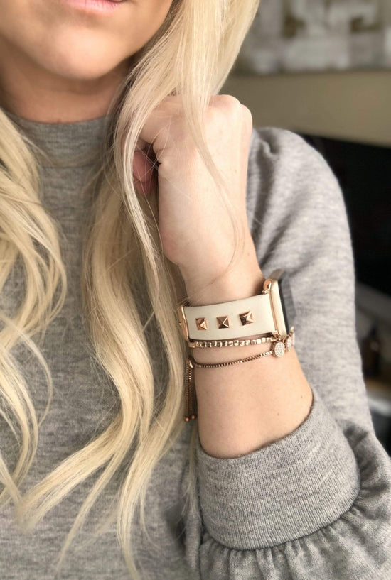 Beautiful CREAM top grain genuine LEATHER, STUDDED Apple Watch Band. This watch band features a stainless steel buckle and is adorned with three metal studs on each side. Stud color choices include Silver, Gold, and Rose Gold.  This watch band fits all series of Apple Watches. Comes in sizes 38/40 and 42/44