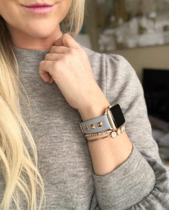 Beautiful GREY top grain genuine LEATHER, STUDDED Apple Watch Band. This watch band features a stainless steel buckle and is adorned with three metal studs on each side. Stud color choices include Silver, Gold, and Rose Gold.  This watch band fits all series of Apple Watches. Comes in sizes 38/40 and 42/44