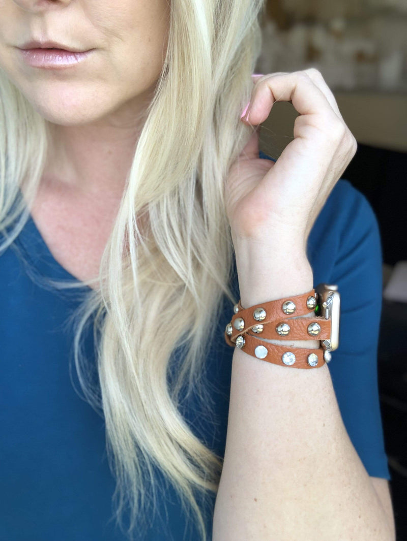 Super soft camel brown colored leather wrap Apple Watch Band with silver studs and crystal studs. 3 snaps to help you find your perfect size Sizing: fits a wrist size of 5.75”- 7”. Available for watch sizes 38/40/42/44mm fitting all series apple watches.