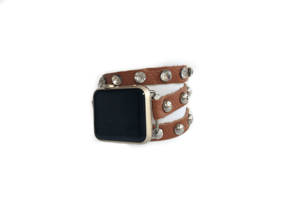 Super soft camel brown colored leather wrap Apple Watch Band with silver studs and crystal studs. 3 snaps to help you find your perfect size Sizing: fits a wrist size of 5.75”- 7”. Available for watch sizes 38/40/42/44mm fitting all series apple watches.
