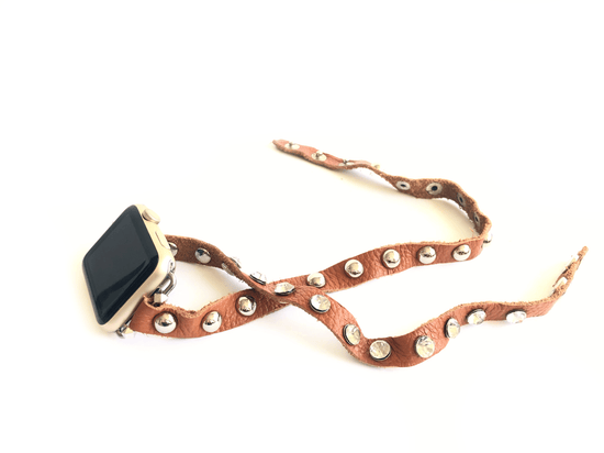Super soft camel brown colored leather wrap Apple Watch Band with silver studs and  crystal studs. 3 snaps to help you find your perfect size Sizing: fits a wrist size of 5.75”- 7”. Available for watch sizes 38/40/42/44mm fitting all series apple watches.