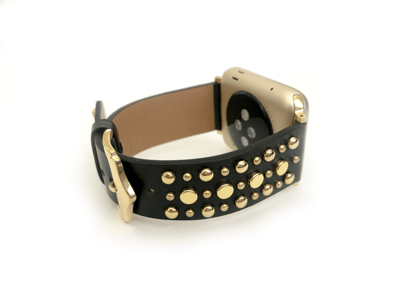 Beautiful BLACK top grain genuine LEATHER, STUDDED Apple Watch Band. This watch band features a stainless steel buckle and is adorned with several flat circular studs. Stud color choices include Silver, Gold, and Rose Gold.  This watch band fits all series of Apple Watches. Comes in sizes 38/40 and 42/44