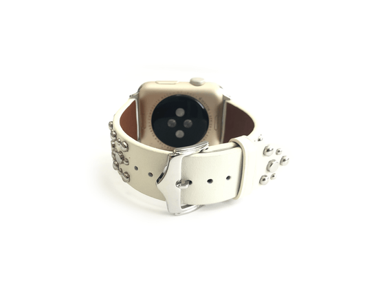 Beautiful WHITE top grain genuine LEATHER, STUDDED Apple Watch Band. This watch band features a stainless steel buckle and is adorned with several flat circular studs. Stud color choices include Silver, Gold, and Rose Gold.  This watch band fits all series of Apple Watches. Comes in sizes 38/40 and 42/44