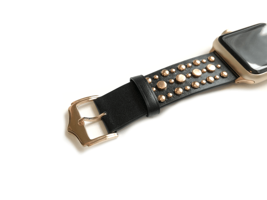 Beautiful BLACK top grain genuine LEATHER, STUDDED Apple Watch Band. This watch band features a stainless steel buckle and is adorned with several flat circular studs. Stud color choices include Silver, Gold, and Rose Gold.  This watch band fits all series of Apple Watches. Comes in sizes 38/40 and 42/44