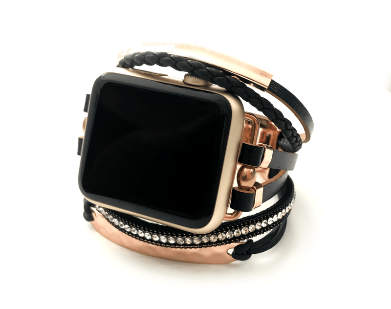 Luxury apple watch band with faux black leather straps that give a bracelet style look to your apple watch. Accented with rose gold plates, crystals, and rose gold metallic finishes. Adjustable fold over clasps for easy sizing.