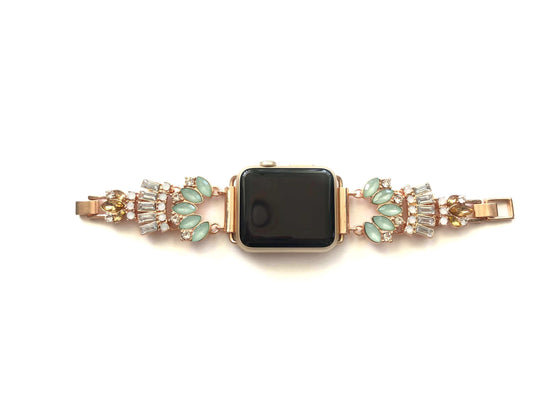 Rose Gold jeweled apple watch band with mint, clear, opal and amber glass crystals. All crystals paced in an unique 1920 inspired pattern that lead to size adjustable clasps. This beautiful band fits all series of apple watches in sizes 38, 40, 42, and 44