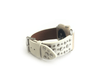 Beautiful WHITE top grain genuine LEATHER, STUDDED Apple Watch Band. This watch band features a stainless steel buckle and is adorned with several flat circular studs. Stud color choices include Silver, Gold, and Rose Gold.  This watch band fits all series of Apple Watches. Comes in sizes 38/40 and 42/44