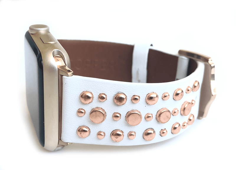 Beautiful WHITE top grain genuine LEATHER, STUDDED Apple Watch Band. This watch band features a stainless steel buckle and is adorned with several flat circular studs. Stud color choices include Silver, Gold, and Rose Gold.  This watch band fits all series of Apple Watches. Comes in sizes 38/40 and 42/44