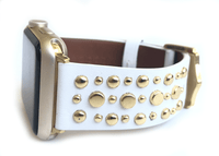 Beautiful WHITE top grain genuine LEATHER, STUDDED Apple Watch Band. This watch band features a stainless steel buckle and is adorned with several flat circular studs. Stud color choices include Silver, Gold, and Rose Gold.  This watch band fits all series of Apple Watches. Comes in sizes 38/40 and 42/44