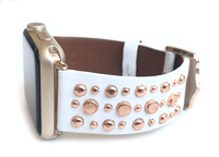 Beautiful WHITE top grain genuine LEATHER, STUDDED Apple Watch Band. This watch band features a stainless steel buckle and is adorned with several flat circular studs. Stud color choices include Silver, Gold, and Rose Gold.  This watch band fits all series of Apple Watches. Comes in sizes 38/40 and 42/44