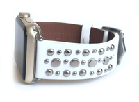 Beautiful WHITE top grain genuine LEATHER, STUDDED Apple Watch Band. This watch band features a stainless steel buckle and is adorned with several flat circular studs. Stud color choices include Silver, Gold, and Rose Gold.  This watch band fits all series of Apple Watches. Comes in sizes 38/40 and 42/44